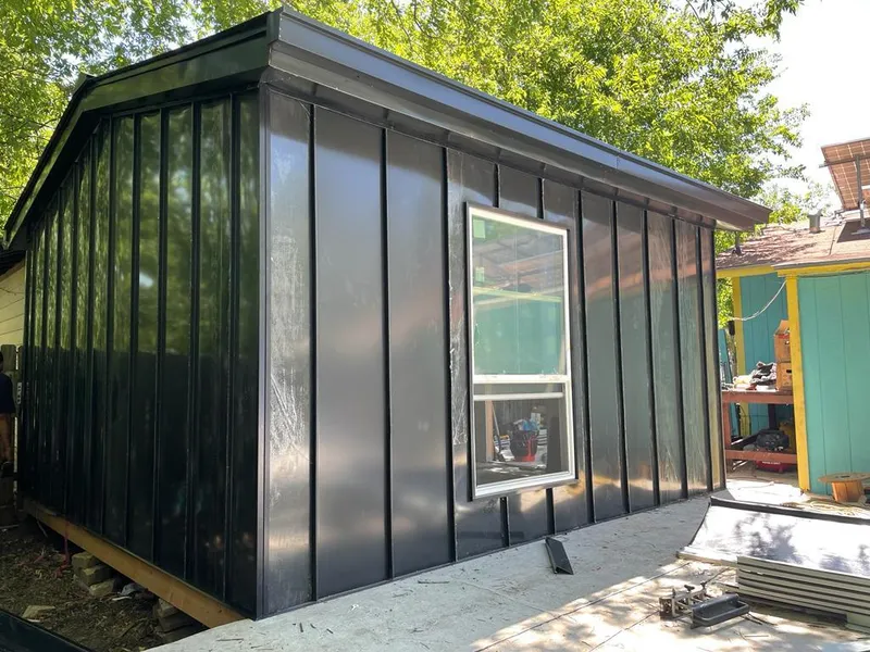 Black standing seam metal wall panels for Roof Inspection in Ocean